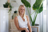 Osteopath at Gold Coast's Vyne Health Michelle Moloney in reception chair 